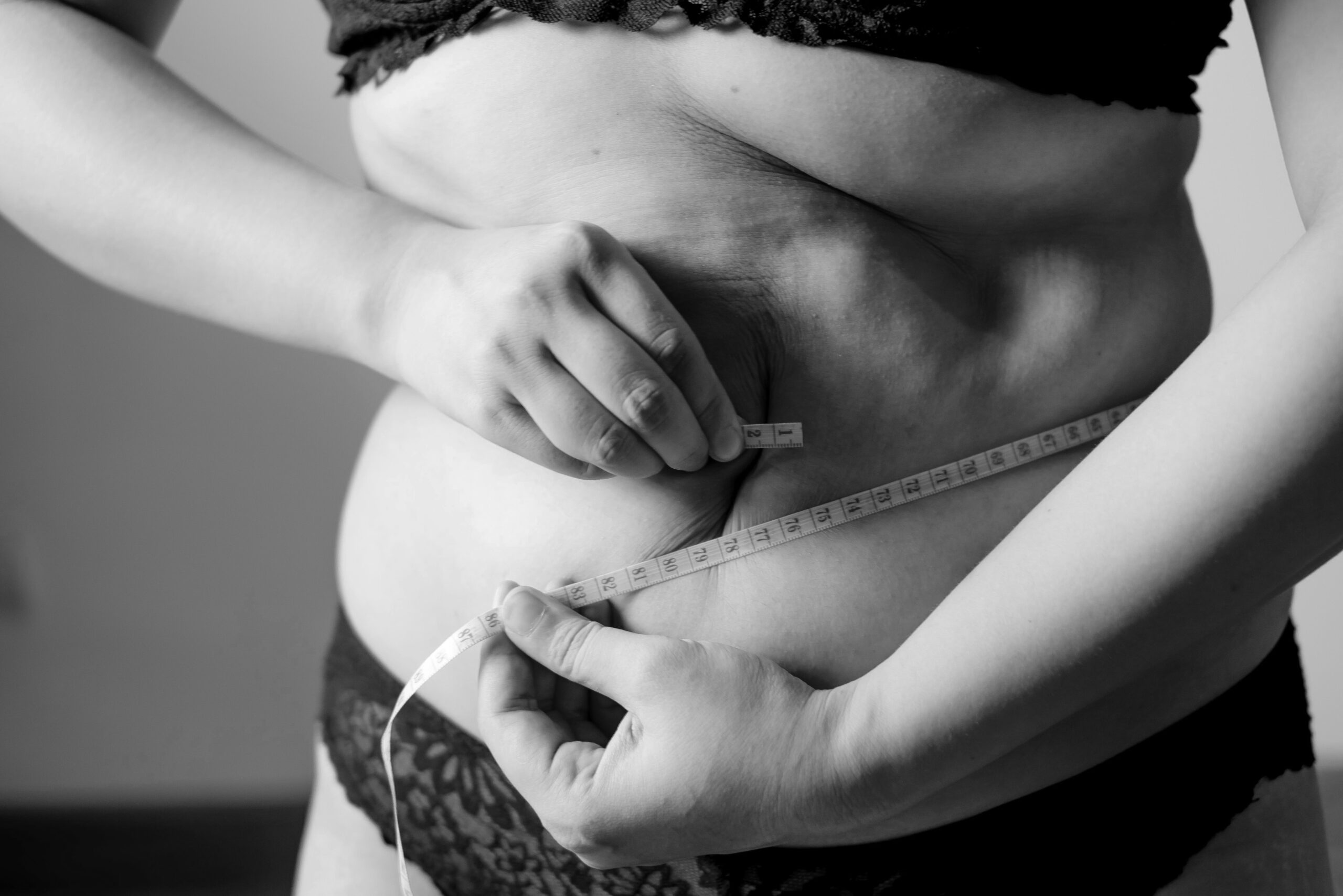 woman measuring waist